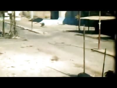 FSA Cameraman Captures his Comrades Suicide When He Runs into a Building with a Bomb