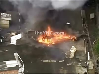 Van Explodes Nearly Killing Morons when Rioting Crowd of Idiots Pushes it into Fire
