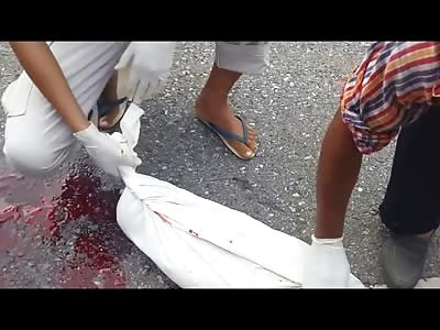 Bloody Brother are Peeled off the Street after Accident