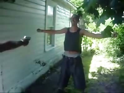 Ghetto Imbecile Lets his Homeboy Shoot Him with a .32 While Wearing a Vest.... 
