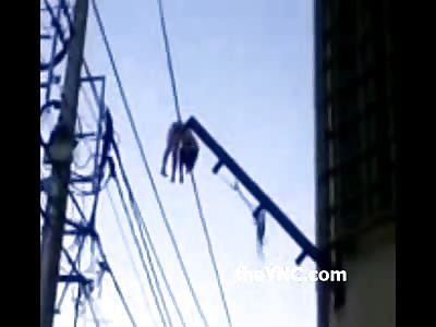 Short Video of a Dead Woman Dangling off of Power Line