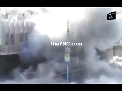 A New Style...Rebel drops an IED on a Humvee from the Rooftop