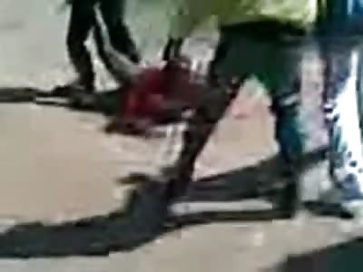 Wheelie...Short Video of Mob using a Man to do Wheelies with their Bikes