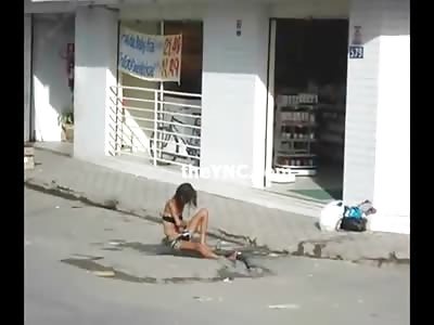 Sad Video of Homeless Drug Addict Girl Bathing in the Dirty Rain Puddle