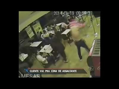 Gunman trying to Rob Restaurant with Gun gets put in the Old WWE Headlock