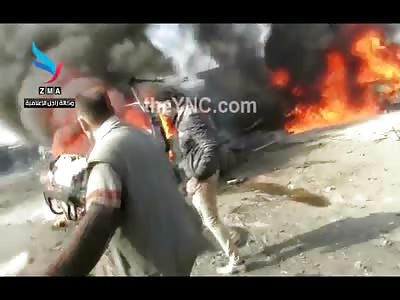 Charred Bodies Fall out of Burning Car after Bombing....People Rush to Try and Rescue