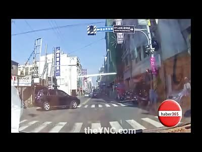Dashcam of Scooter Man ending up Underneath a Car in Street Accident