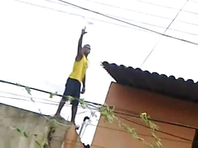 Guy Trying to Untangle his Kite From atop Building Loses his Balance.....