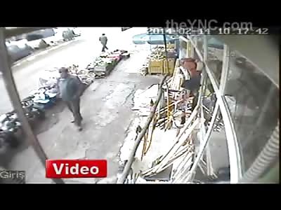 Guy is Literally Sideswiped by a Car Sent Flying into Produce Bins
