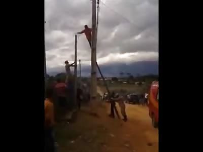 Man Jumps from Pole in Suicide as Police Beg for Him to Come Down..Yes he Died from This Height