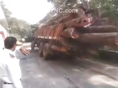 Simple Task Turns Deadly When this Lumber Truck Tips over a Mountain
