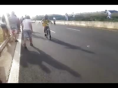 Kid Goes into Violent Convulsions after Riding Down the Wrong Way Trying to Show Off on his Bike