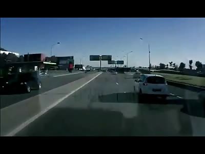 Motorcyclist Flies into Oncoming Traffic over Highway Divider