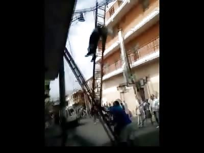 Worker Dangles Being Electrocuted as People Try to Help But have No Idea How
