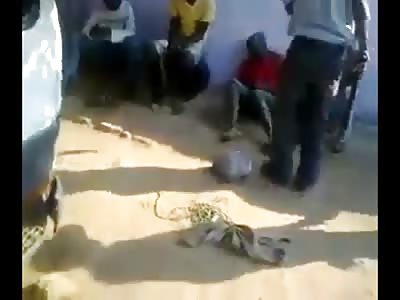 Thieves being beaten in the ass by police in Angola