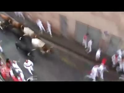 Bulls Gore Three People at the End of the Pamplona Run .. One has his Thigh Ripped Wide Open