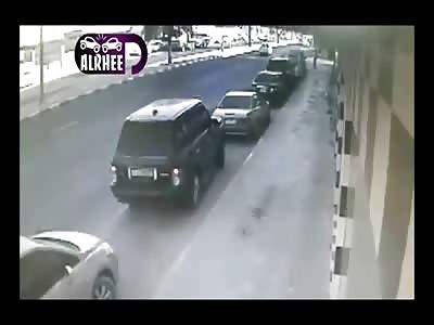 Out of Control Dump Truck Terrorizes Sidewalk and a Range Rover trying to Get Out of Parking Spot