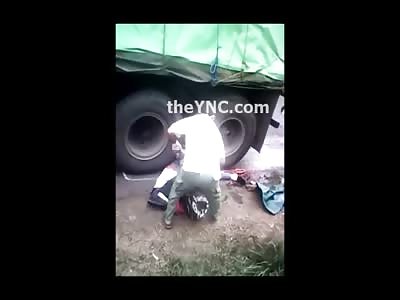 People Trying to Remove Crushed Rider and His Crushed Passenger from Underneath Truck (Gruesome) 