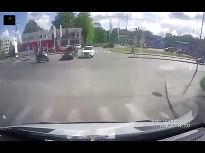 Lucky Motorcyclist gets a Padded Fall after Collision by a Audi and a Mercedes 