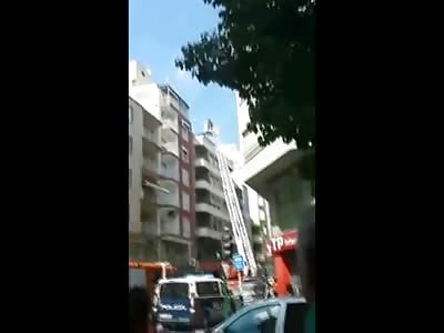 Man Dives off Building Just as Rescuers are Arriving