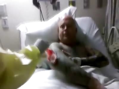 Tattoo Man in Hospital Bed has Gruesome Wound on his Arm and Wants to Show it Off 