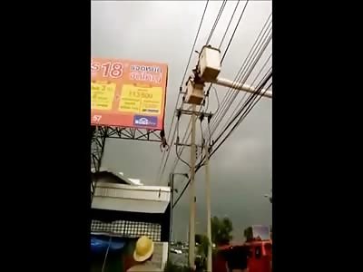 Electrocuted Man Dangling from Billboard is Pulled Down by Rescue Team 