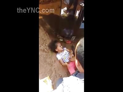 Very Sad Video Show Little Girl Reaching for Help with her Baby Sister Dead on the Road and Mother Twisted Up