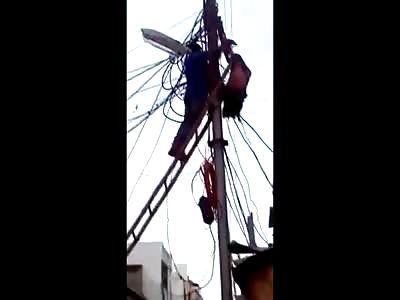 How Did He Even Manage This?? Dangling Man on Fire Hangs from Telephone Wires 