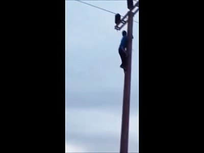 Young Kid Climbs an Electric Pole to Impress his Friends....