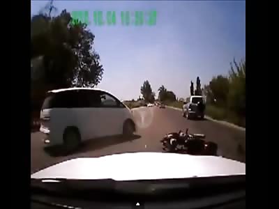 Reckless driver makes rider flip in the air 