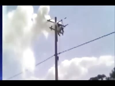 Man Frying and Smoking Over Electric Pole