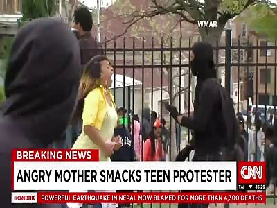[CNN] Angry mom smacks protesting son in HD