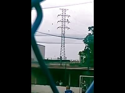 Second Angle shows Man's Suicide off Power Lines while Kids Play Soccer 