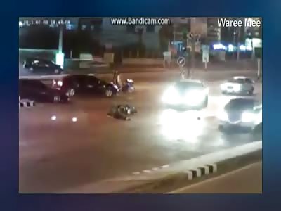 Scooter Rider is Killed not Paying Attention and Lies in the Street during Traffic 