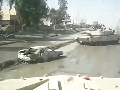 Abrams destroys a car bomb by rolling over it 