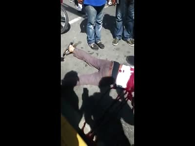 Man Dying on the street from Gunshot to the Back