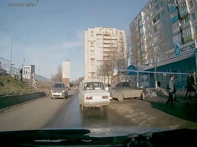 Oblivious woman in pink hit by car in Russia.