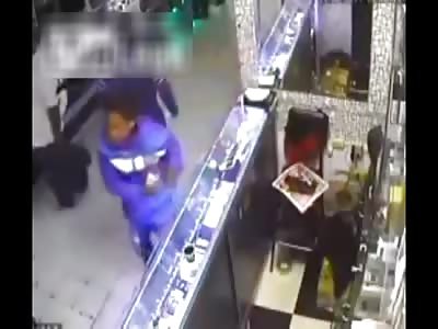 Thief is beaten by entire store.