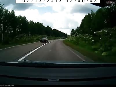 Car trys to overtake tractor but ends up doing roll