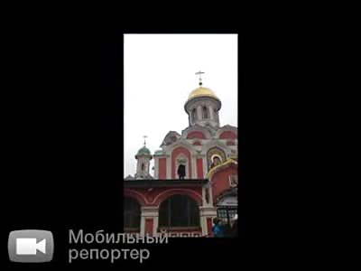Muslim Stands on The Roof of Orthodox Church in Moscow and Screams 