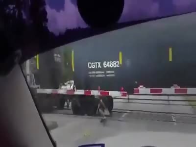 Playing with death in Texas - man rolling under train