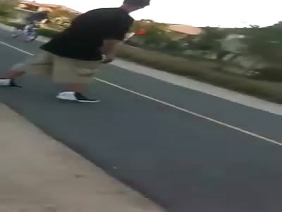 Man Riding his Bicycle is Attacked by Gang Member for Fun