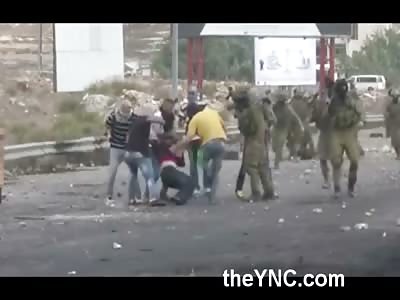 Palestinian Man is Beaten by a Mob then Shot by Dude in Yellow Shirt