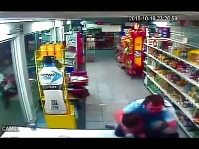 Workers Beat Armed Man Trying to Rob Store