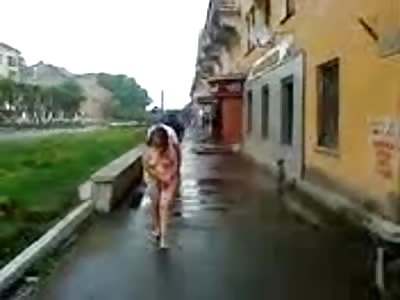 Absolutly naked woman walking around on the streets
