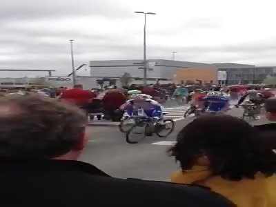 Lady crosses road during speedcycle race