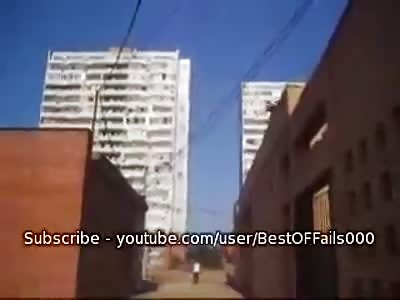 Guy tries to jump between roofs... breaks anus