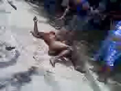 Naked Man set on Fire by Happy Mob of people 