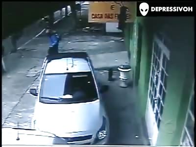 *BRAZIL* (2-angle CCTV) Store owner cowardly shot in the back of the head while talking on his cellphone.