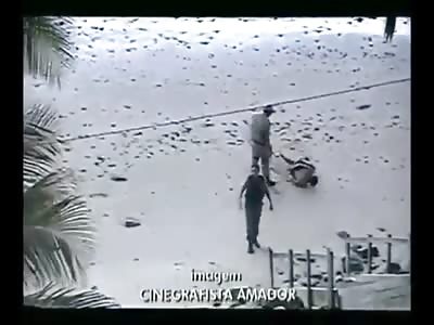 *BRAZIL* POLICE ABUSE! Cops beat and drown handcuffed robber on the beach